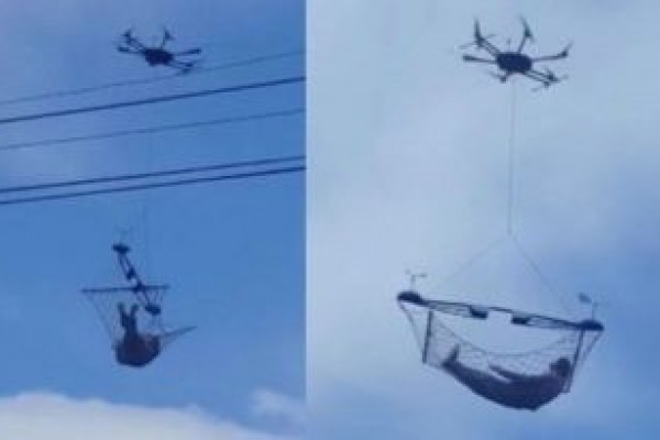 VIDEO: Heboh! Orang ini Diangkut ke Atas Awan Menggunakan Drone