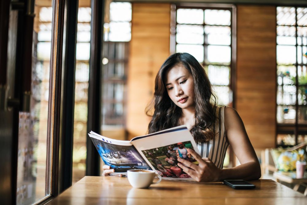 Is she reading a magazine