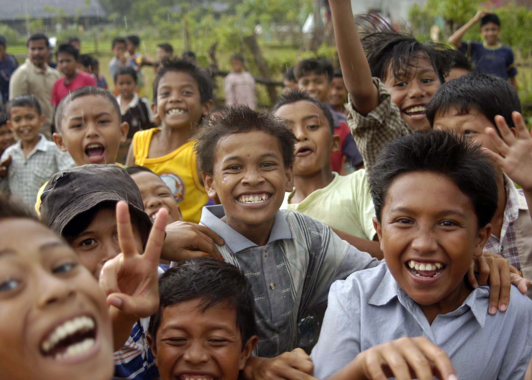 us-navy-050105-n-5376g-019-indonesian-children-smile-and-cheer-as-us-navy-helicopters-from-uss-abraham-lincoln-cvn-72-fly-in-purified-water-and-relief-supplies-to-a-small-village-on-the-isla-0a861a73a3d8a60987aa31091591b560.jpg