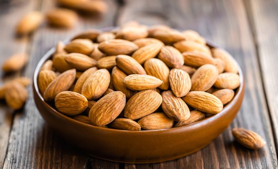 almonds-in-a-bowl-on-wooden-table-max-6cff40586eafdd6deb000b778cae237a.jpg
