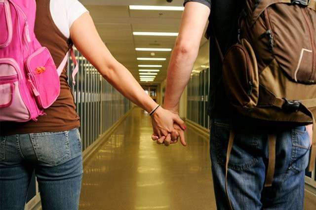 teens-holding-hands-in-school-341c11d5c5ee59594e9d8336044575f4.jpg