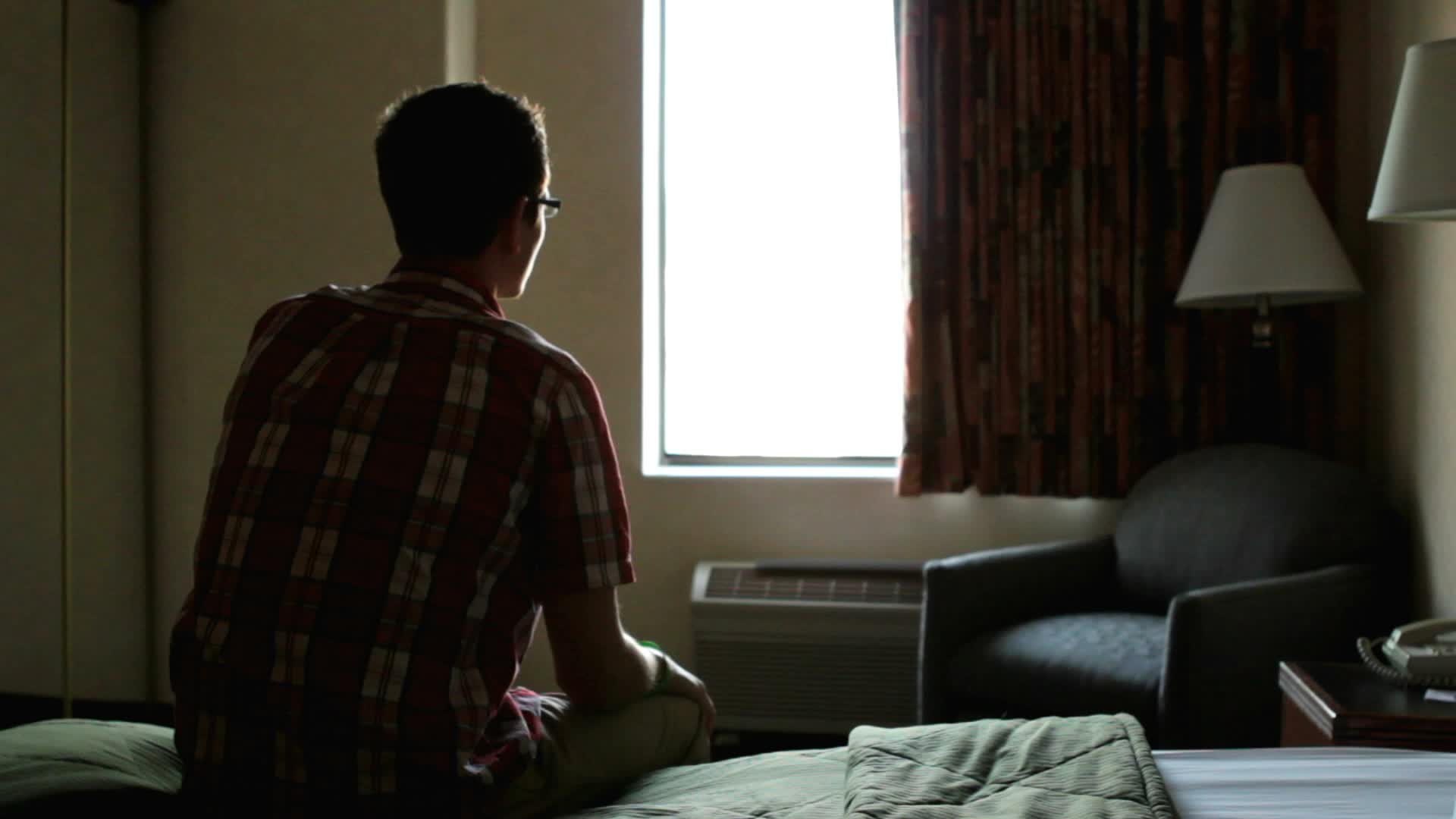 lonely-man-sitting-hotel-room-footage-012008142-prevstill-60b28e1e5c454d7fd185759100637bee.jpeg