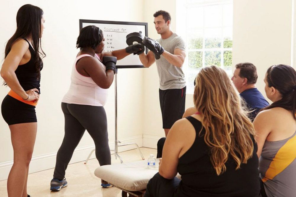 Exercise helps us. Фитнес тренер и его полная жена.