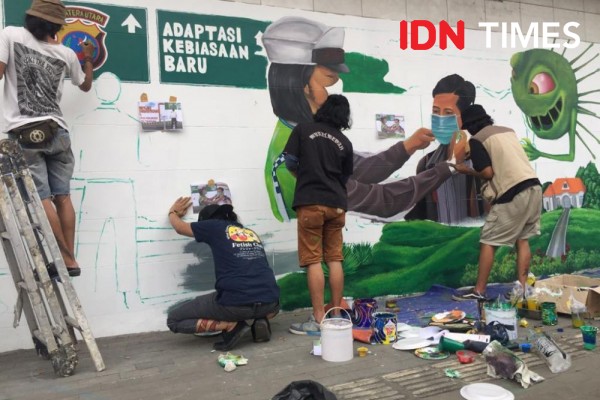 Generasi Millenial Medan Ingatkan Warga Pakai Masker Lewat Mural